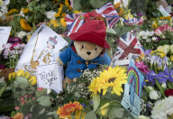 Floral tributes for HM The Queen Elizabeth II are left by mourners in Green Park London