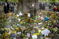 Floral tributes for HM The Queen Elizabeth II are left by mourners in Green Park London