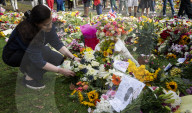 Floral tributes for HM The Queen Elizabeth II are left by mourners in Green Park London