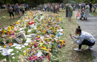 Floral tributes for HM The Queen Elizabeth II are left by mourners in Green Park London