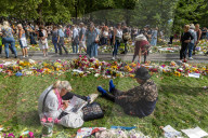 members of the public lay flowers in green Park, London