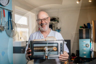 Portrait of inventor Philip Davies and his Artificial Intelligence powered toaster