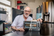 Portrait of inventor Philip Davies and his Artificial Intelligence powered toaster