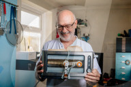 Portrait of inventor Philip Davies and his Artificial Intelligence powered toaster