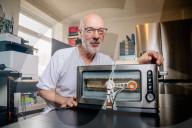 Portrait of inventor Philip Davies and his Artificial Intelligence powered toaster