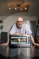 Portrait of inventor Philip Davies and his Artificial Intelligence powered toaster