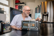 Portrait of inventor Philip Davies and his Artificial Intelligence powered toaster