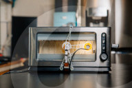 Portrait of inventor Philip Davies and his Artificial Intelligence powered toaster