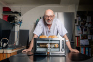 Portrait of inventor Philip Davies and his Artificial Intelligence powered toaster