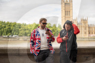 People queuing along the River Thames in London
