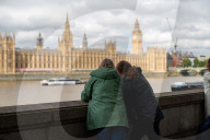 People queuing along the River Thames in London