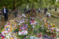 Mourners pay their respects and lay flowers in Green Park London
