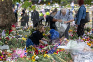 Mourners pay their respects and lay flowers in Green Park London