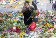 Mourners pay their respects and lay flowers in Green Park London
