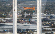 Just Stop Oil protest at Queen Elizabeth Bridge over The River Thames in Dartford.