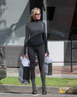 Melanie Griffith In A Form Fitting All Black Outfit