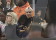 Kim Kardashian at basket ball game with Kanye West