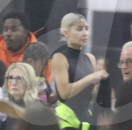 Kim Kardashian at basket ball game with Kanye West