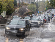 Public brave the flash flooding in Putney High Street south west London.