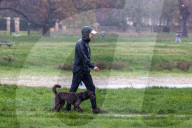 Public brave the flash flooding in Putney High Street south west London.