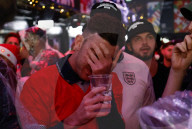 Fans react to the England v France World Cup Quarter Final football match, Boxpark, London.
