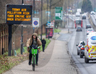 A sign warning drivers of high pollution levels in London, UK.