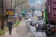 A sign warning drivers of high pollution levels in London, UK.
