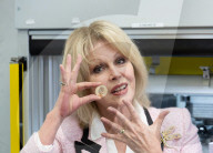 Joanna Lumley presses the first King Charles coins for Gibraltar at Tower Mint, London, UK.