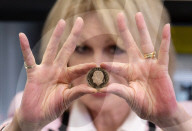 Joanna Lumley presses the first King Charles coins for Gibraltar at Tower Mint, London, UK.
