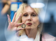 Joanna Lumley presses the first King Charles coins for Gibraltar at Tower Mint, London, UK.