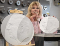 Joanna Lumley presses the first King Charles coins for Gibraltar at Tower Mint, London, UK.