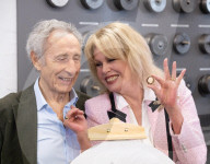 Joanna Lumley presses the first King Charles coins for Gibraltar at Tower Mint, London, UK.