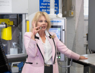 Joanna Lumley presses the first King Charles coins for Gibraltar at Tower Mint, London, UK.