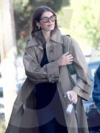Kaia Gerber, 21, is all smiles as she takes her pet dog for a stroll in Malibu.
