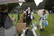 Public watch King Charles III Coronation on big screen at Hampton Court Palace, UK.