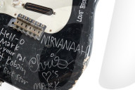 Smashed Kurt Cobain guitar sells for well over half a million dollars.                 