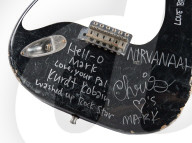 Smashed Kurt Cobain guitar sells for well over half a million dollars.                 