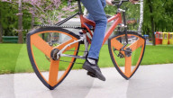 Square wheel bike maker returns with triangular ones           