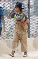Rarely seen Hollywood music mogul Linda Perry shows off her signature bohemian style on a relaxing summer stroll through LAâ€™s hipster Los Feliz district with a male friend. 