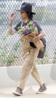 Rarely seen Hollywood music mogul Linda Perry shows off her signature bohemian style on a relaxing summer stroll through LAâ€™s hipster Los Feliz district with a male friend. 