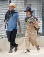 Rarely seen Hollywood music mogul Linda Perry shows off her signature bohemian style on a relaxing summer stroll through LAâ€™s hipster Los Feliz district with a male friend. 
