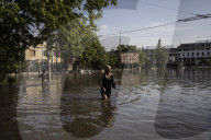 Thousands flee homes as collapse of dam is blamed on Russian forces