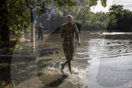 Thousands flee homes as collapse of dam is blamed on Russian forces