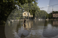Thousands flee homes as collapse of dam is blamed on Russian forces