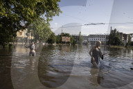 Thousands flee homes as collapse of dam is blamed on Russian forces