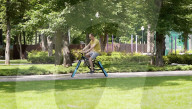 Engineer builds and ride bicyle with no wheels.               