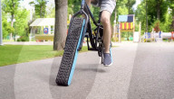 Engineer builds and ride bicyle with no wheels.               