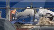 Salvaged Titan submersible wreckage brought shore.             