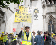Stop ULEZ Coalition - a cross party campaign coalition formed to stop ULEZ outside The Royal Courts of Justice, London, UK.