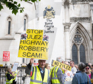 Stop ULEZ Coalition - a cross party campaign coalition formed to stop ULEZ outside The Royal Courts of Justice, London, UK.